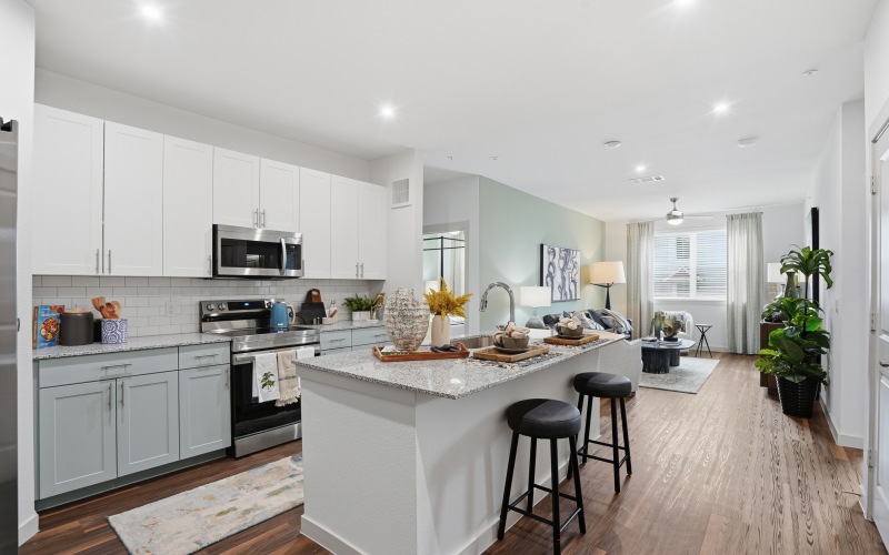 Prose Greenbriar Apartment kitchen with island and granite countertops