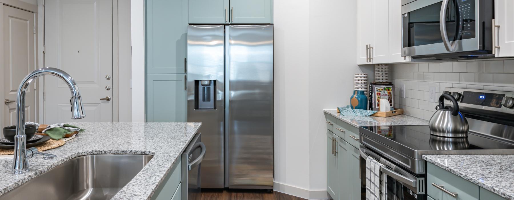 a kitchen with white cabinets