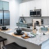 a kitchen with white cabinets