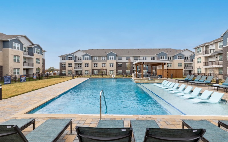 pool with nearness to property and ample shade from covering trees and with reclining seats