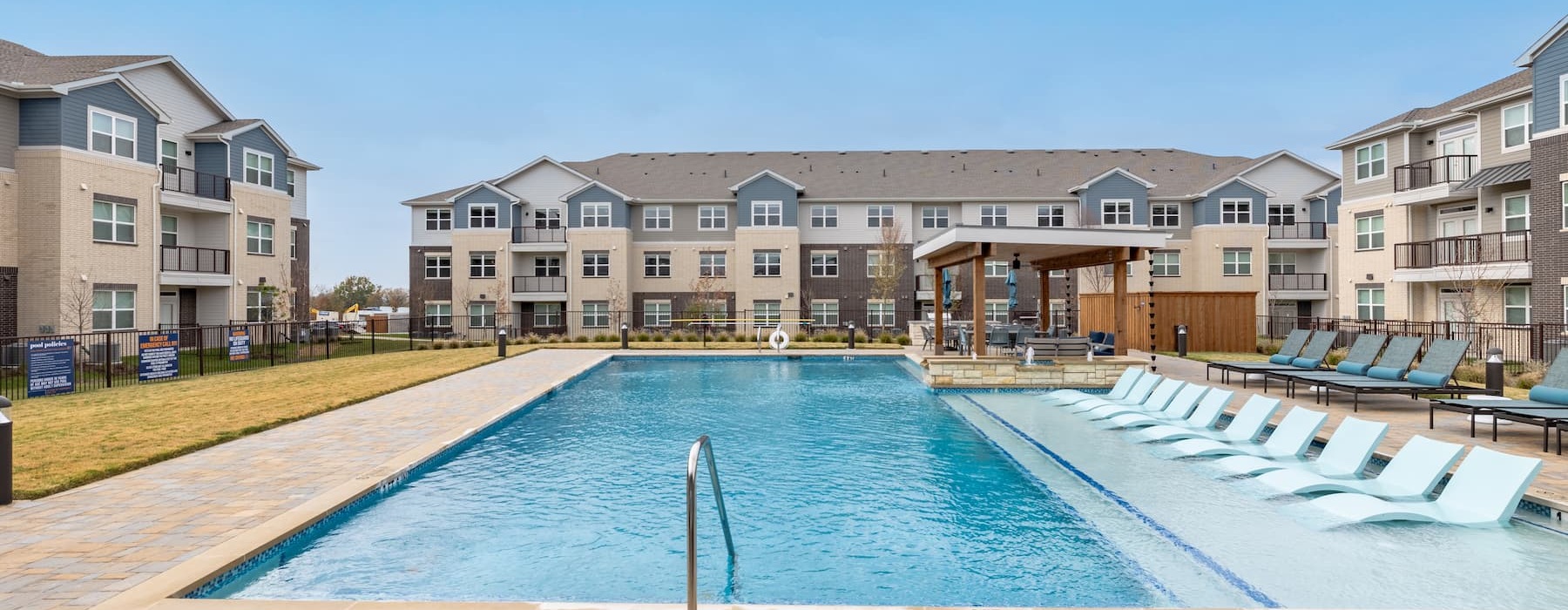 pool with nearness to property and ample shade from covering trees and with reclining seats