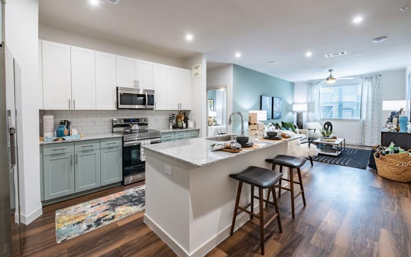 a kitchen with white cabinets