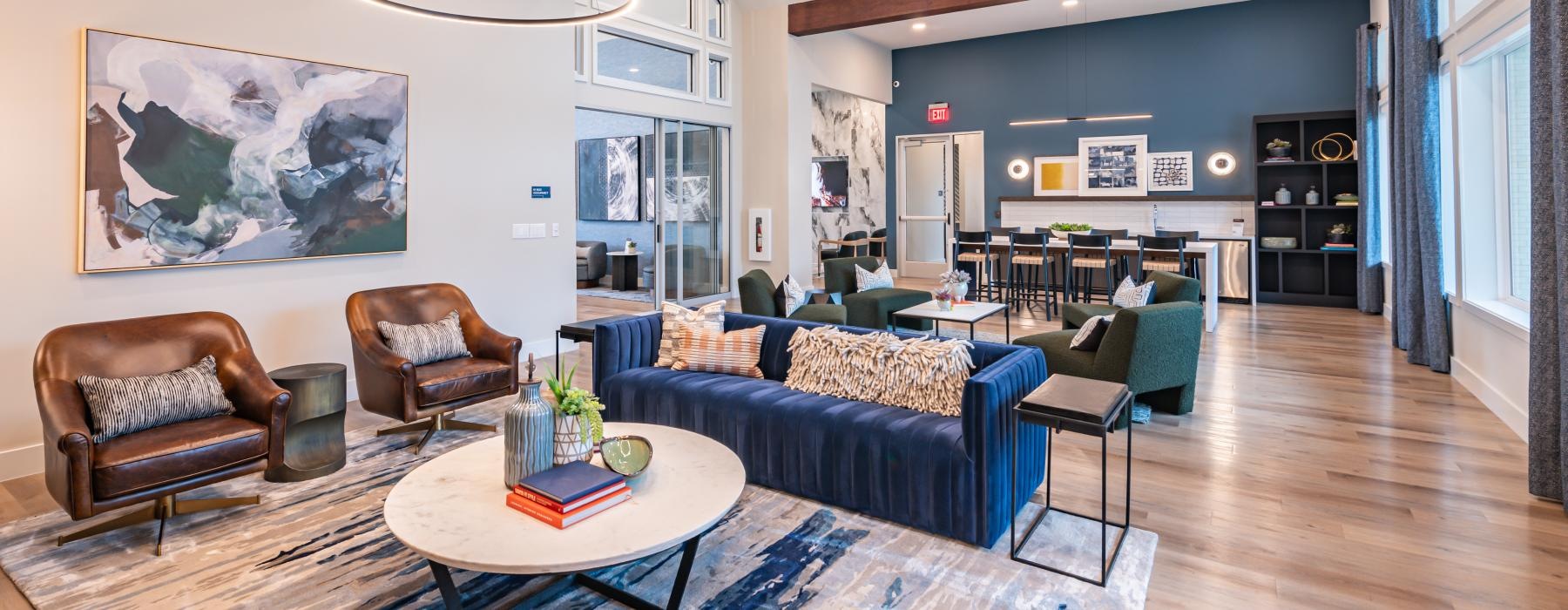 a living room with a blue rug